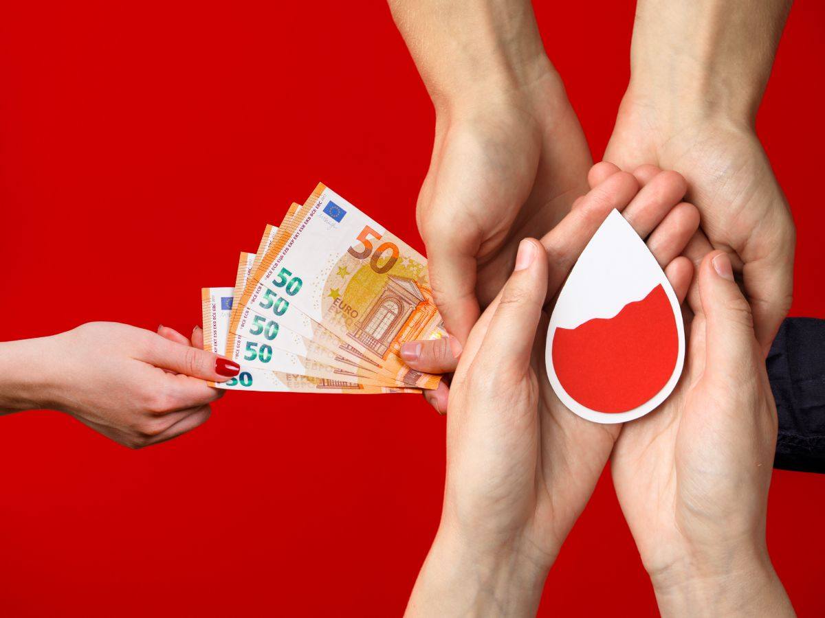sfondo scambio banconote euro e mani con simbolo sangue