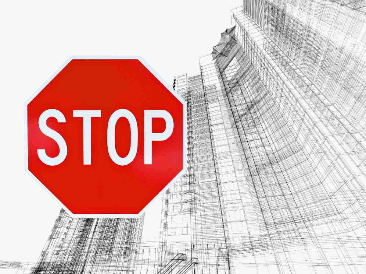 sfondo disegno edilizio e cartello con stop