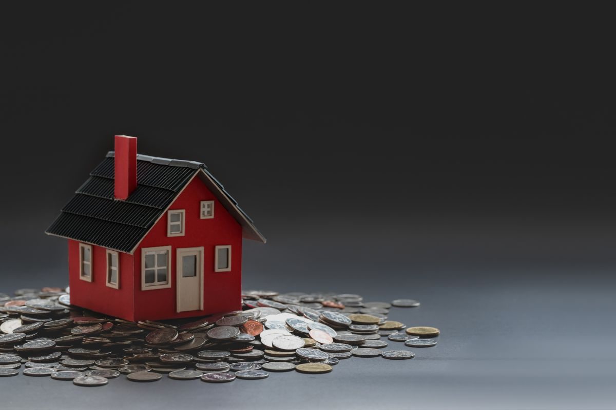 Miniatura casa e monete