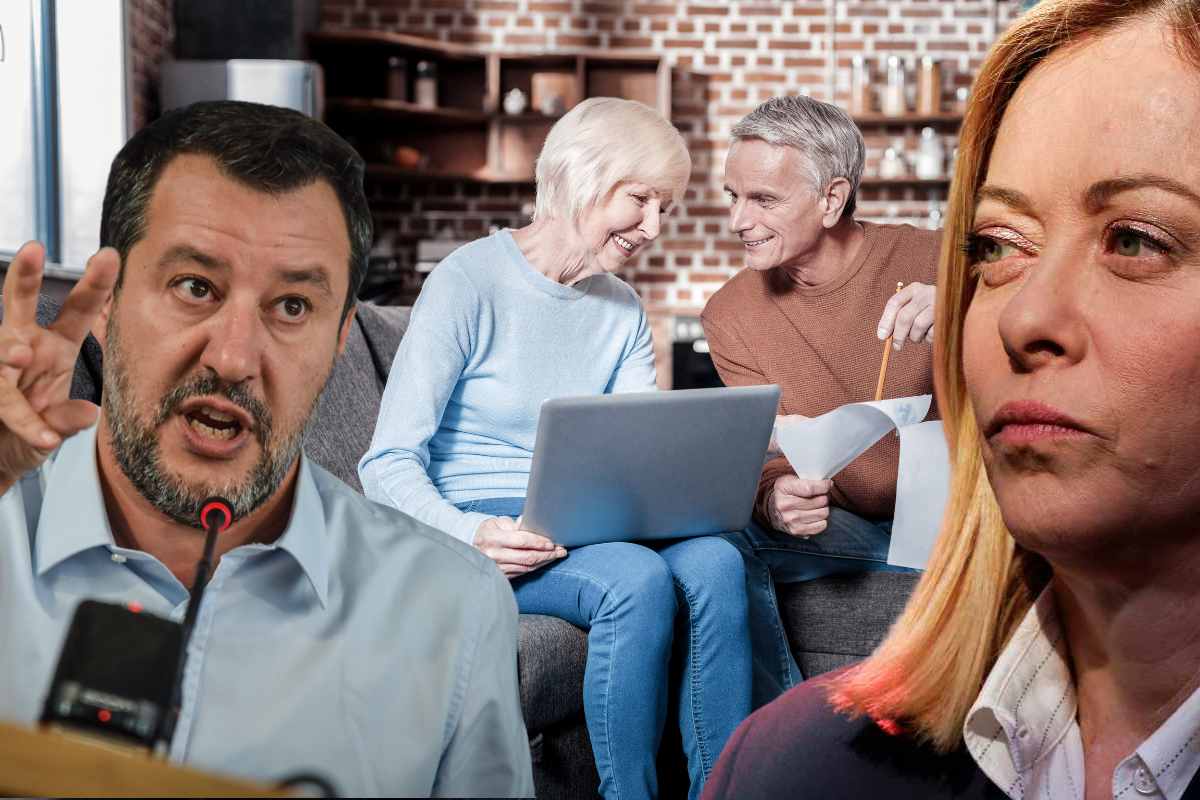 coppia parla con il sorriso con documenti in mano e foto salvini e meloni