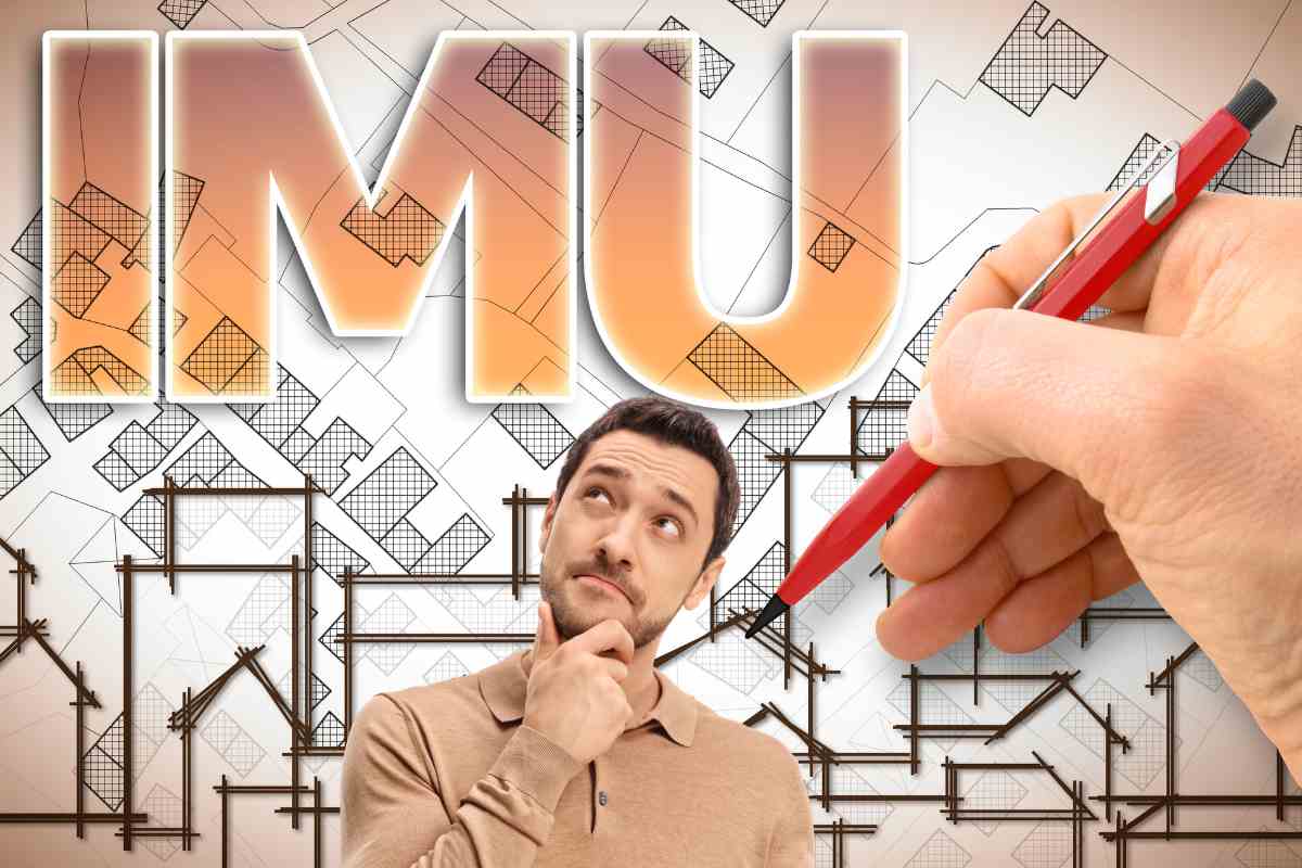 umo guarda pensieroso la scritta imu con penna che disegna